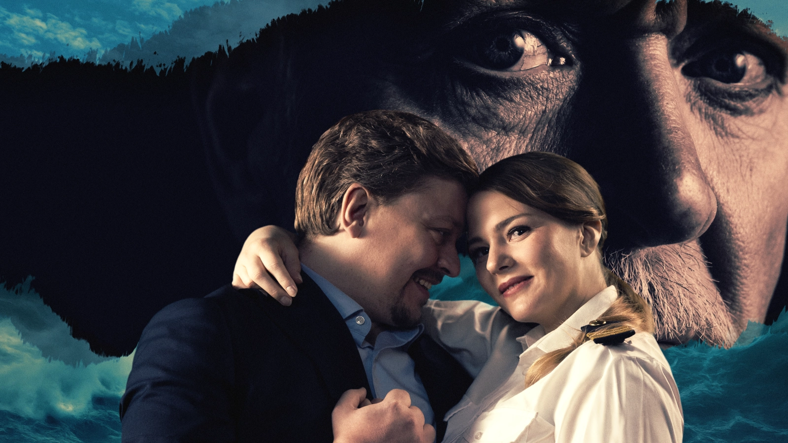 Luisa och Rodolfo omfamnar varandra. Bakom dem syns ett stormigt hav och en mörk ö, där greve Walters ansikte syns.